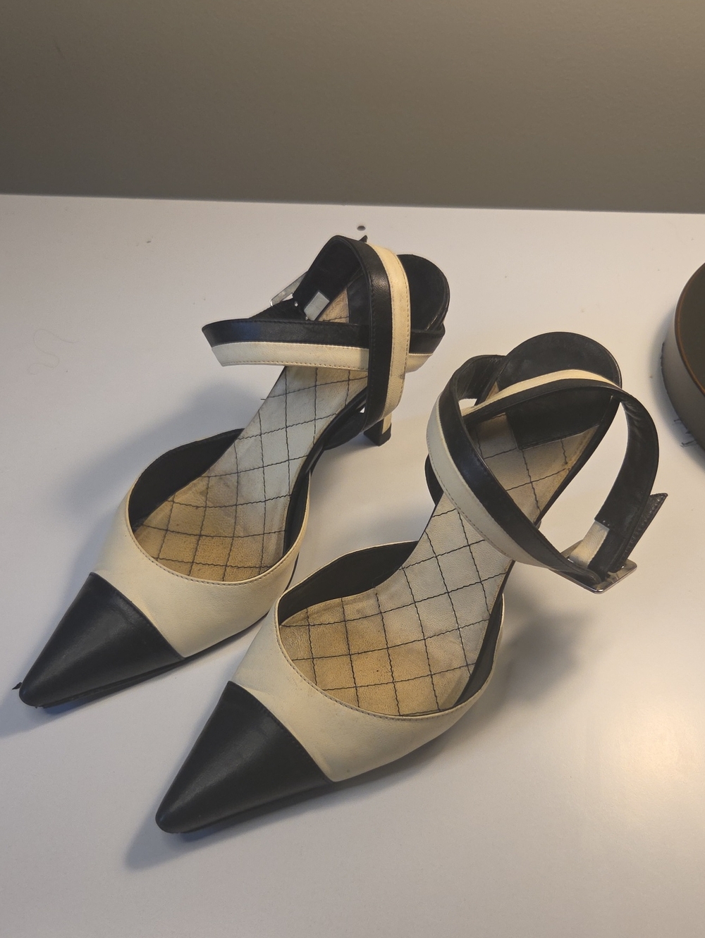 Chanel sling-back pumps feature a sophisticated pointed toe READ 35